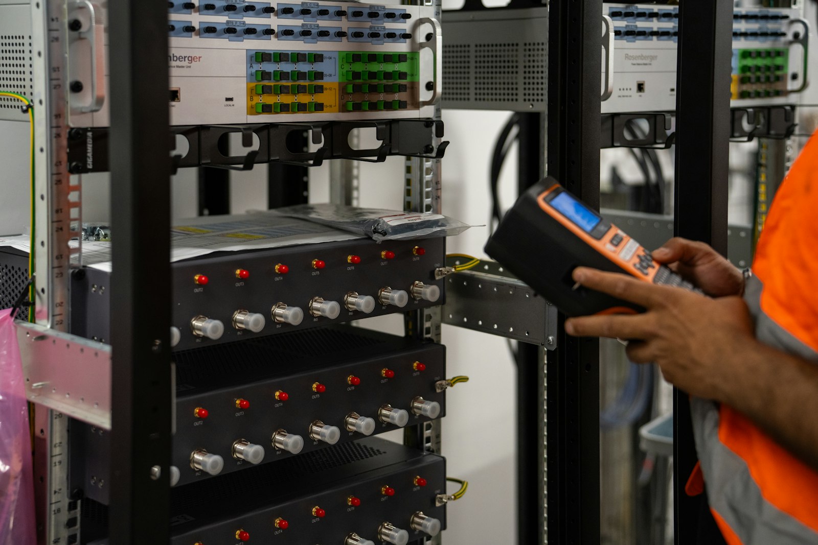 IT technician inspecting server equipment